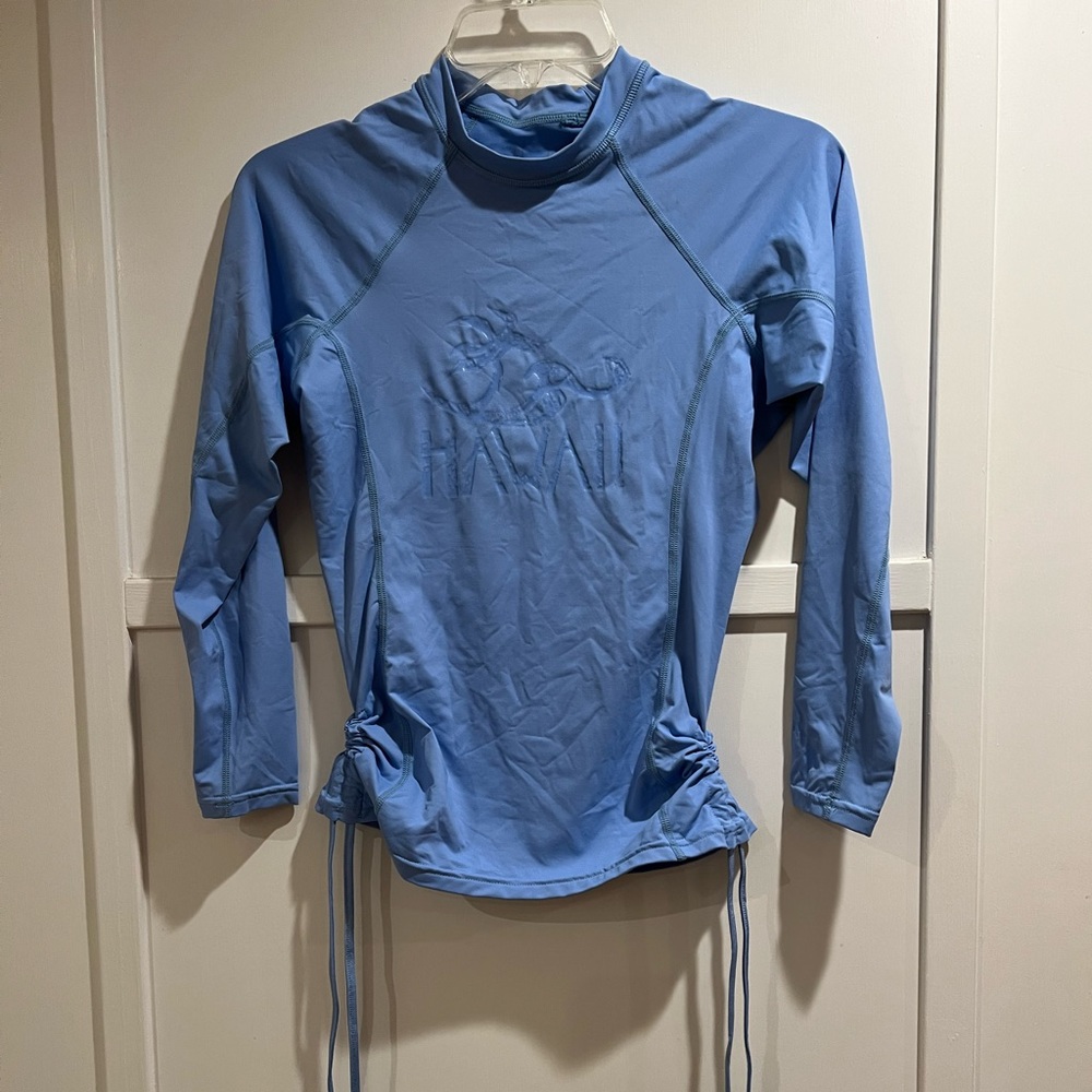 Honolua Wahine blue rash guard with working drawings. M